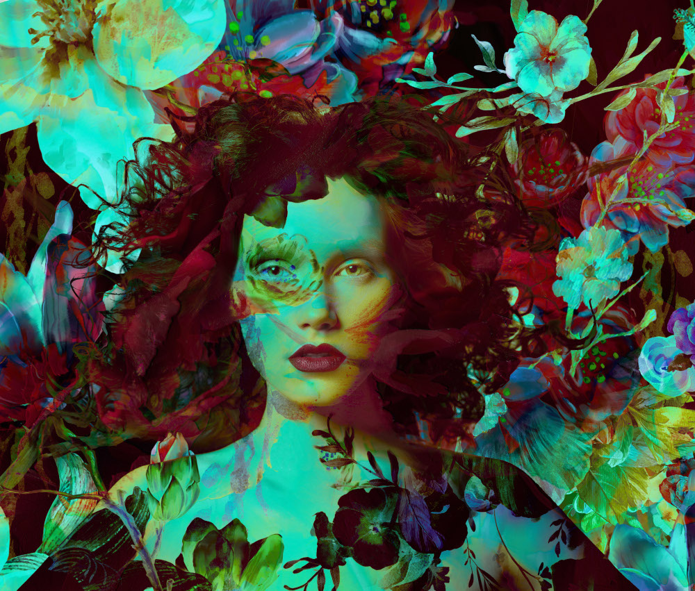 A woman adorned with flowers in her hair and on her face, exuding a vibrant and natural beauty.